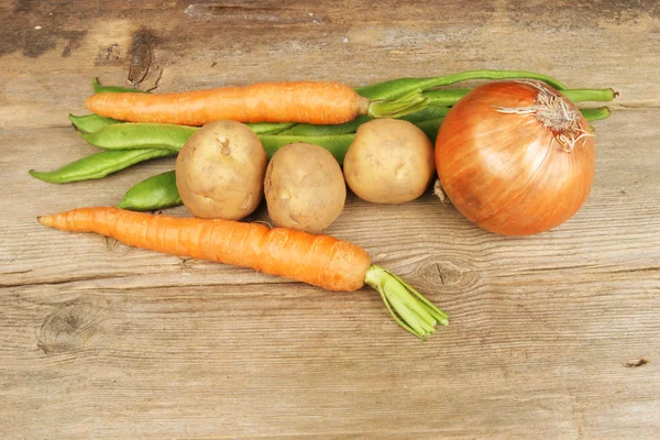 Selection of vegetables on rustic wood — Stock Photo, Image