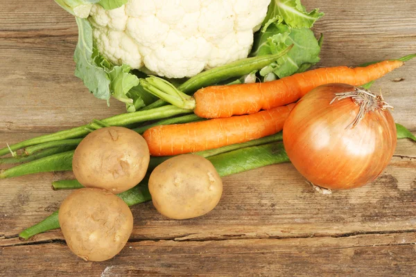 Vegetables on rustic wood — Stock Photo, Image