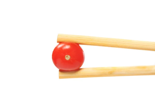 Tomato in chopstick — Stock Photo, Image