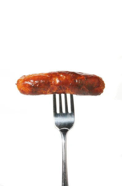Sausage on fork — Stock Photo, Image