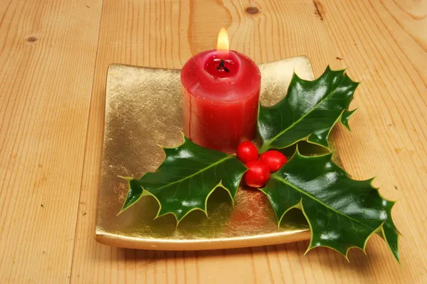 Candle and holly — Stock Photo, Image