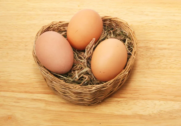 Three eggs in basket — Stock Photo, Image