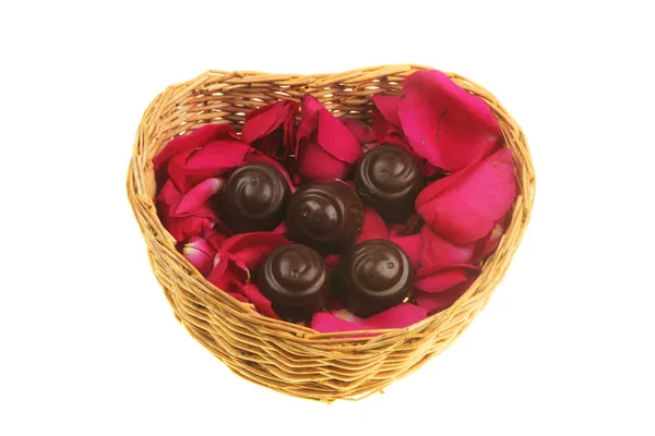 Rose petals and chocolate — Stock Photo, Image