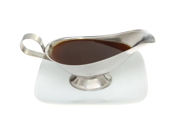 Gravy boat on a plate — Stock Photo, Image