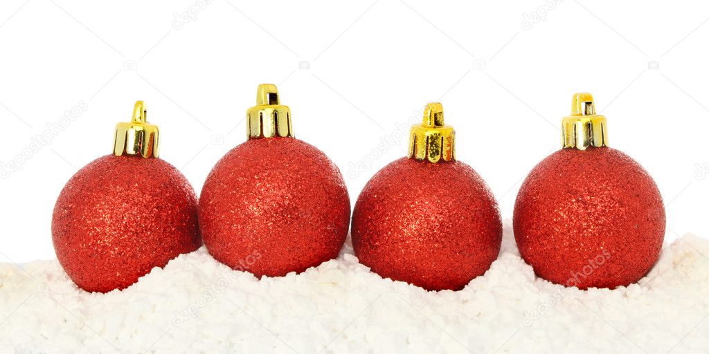 Red baubles on snow