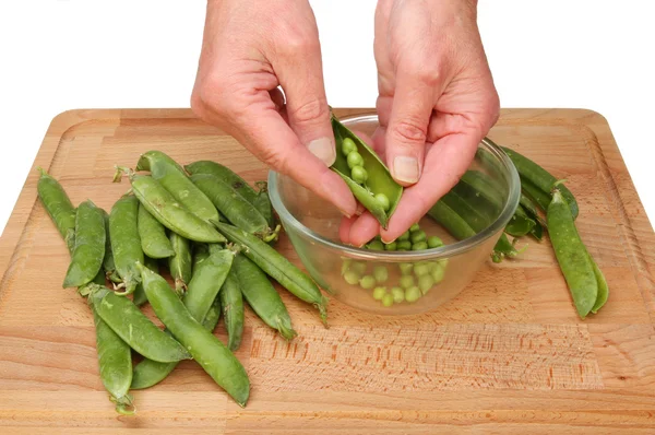 Handen wanneer het doperwten betreft — Stockfoto