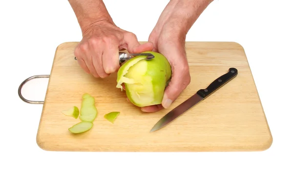 Mãos descascando maçã — Fotografia de Stock