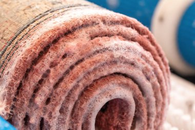 Carpet washing and cleaning. Rolled and washed carpet with foam