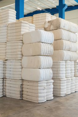 Pile or stack of cotton bales at textile factory or industry