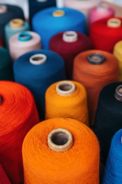 Colorful cotton yarns or threads on spool tube bobbins at cotton yarn factory