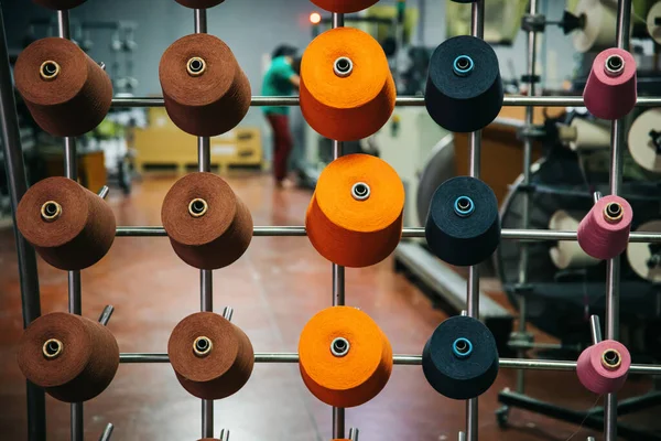 Colorful cotton yarns or threads on spool tube bobbins at cotton yarn factory