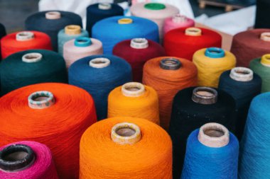 Colorful cotton yarns or threads on spool tube bobbins at cotton yarn factory