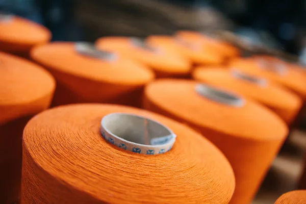 Colorful cotton yarns or threads on spool tube bobbins at cotton yarn factory