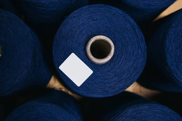 Colorful cotton yarns or threads on spool tube bobbins at cotton yarn factory