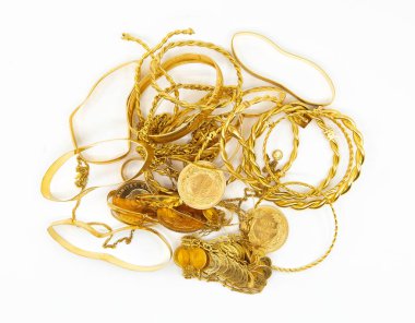 Heap or stack of variety traditional Turkish scrap gold and coins isolated on white background