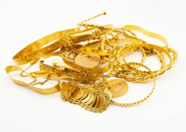 Heap or stack of variety traditional Turkish scrap gold and coins isolated on white background