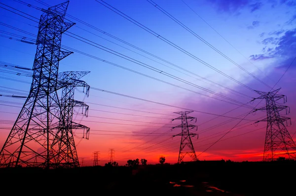 Silhouette electricity pylons — Stock Photo, Image