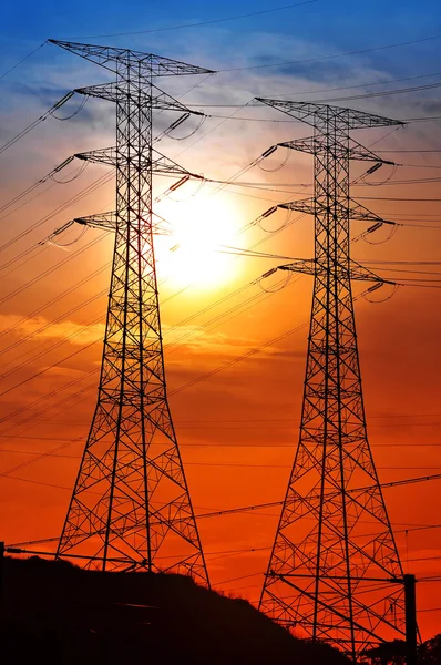 Scenery of silhouetted electrical tower — Stock Photo, Image