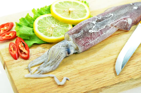 Fresh raw calamari and knife — Stock Photo, Image