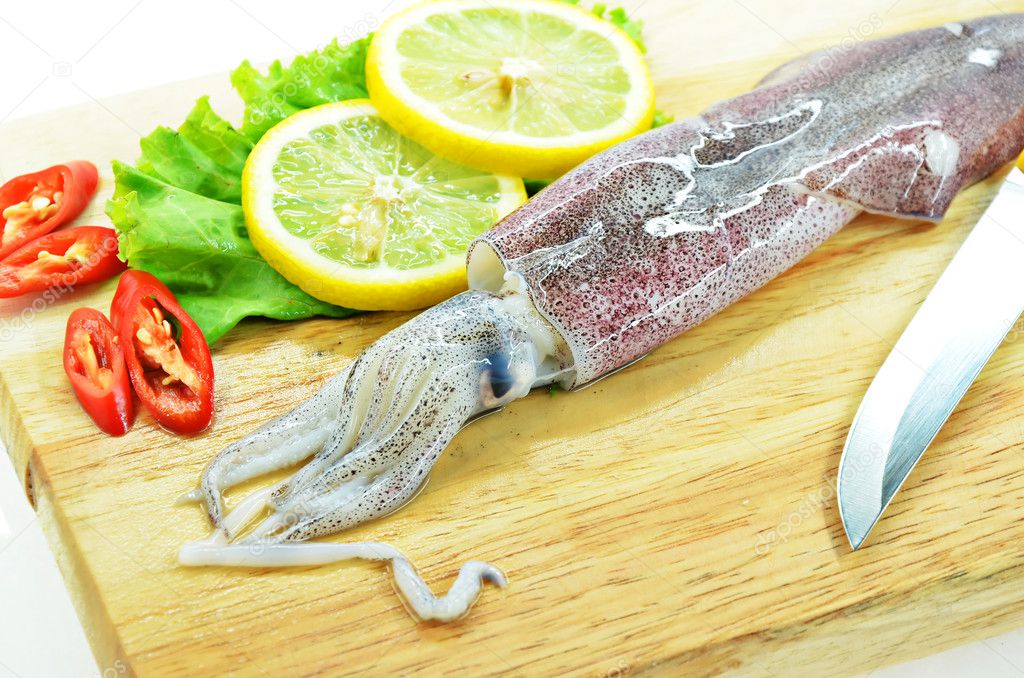 Fresh raw calamari and knife