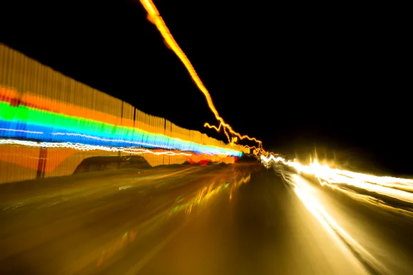 Motion blur street light - night driving — Stock Photo, Image