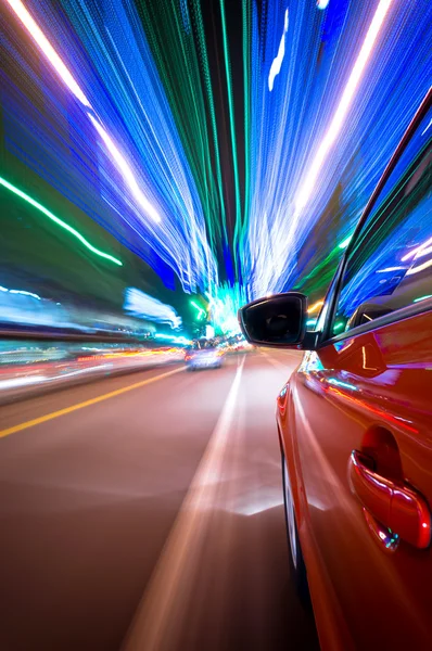 Night driving in city-motion blur building light — Stock Photo, Image