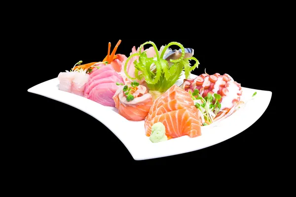 Mixed sashimi in white plate isolated on black background,with c — Stock Photo, Image