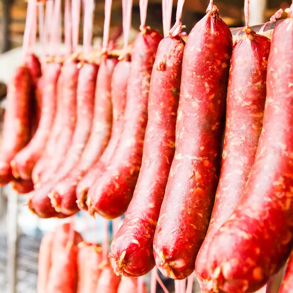 Home made meat salami sausage at street market hanging in line u — Stock Photo, Image