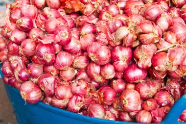 red onions in market clipart