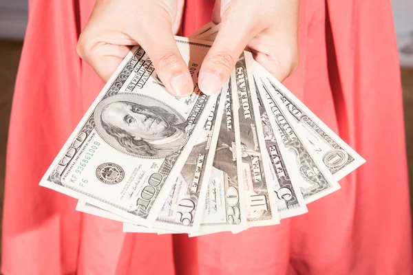 A woman hold dollar banknote in hand — Stock Photo, Image