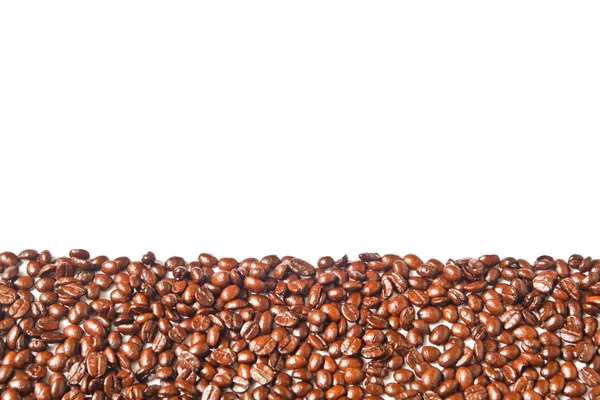 Багато коричневих кавових зерен для фону — стокове фото