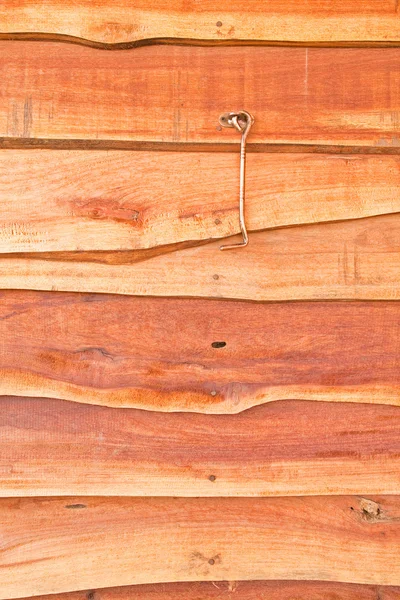 Металлический крюк на деревянной стене — стоковое фото