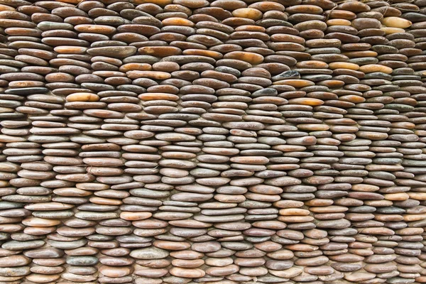 Close up van cirkel pebble muur, abstracte achtergrond — Stockfoto