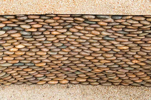 Nahaufnahme von Kreis-Kieselsteinmauer, abstrakter Hintergrund — Stockfoto