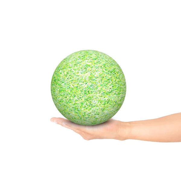 Рука тримає зелену траву м'яч — стокове фото