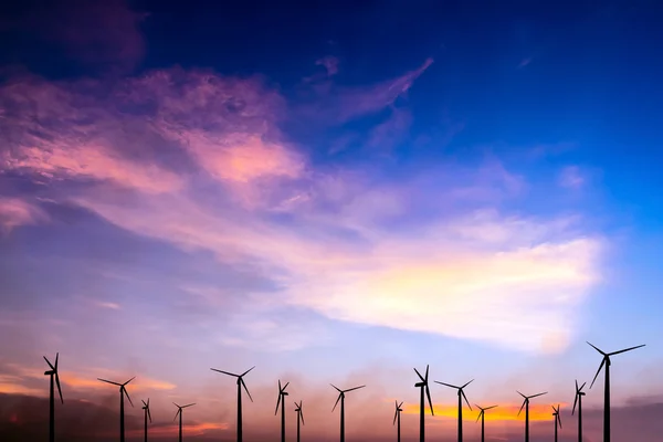 Wind turbine silhouette on colorful sunset — Stock Photo, Image