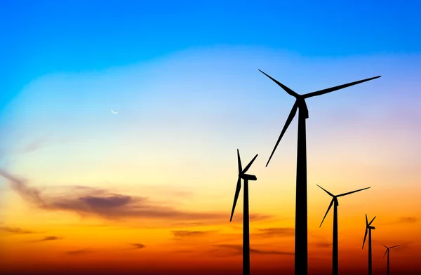 Silueta del aerogenerador en colorido atardecer —  Fotos de Stock