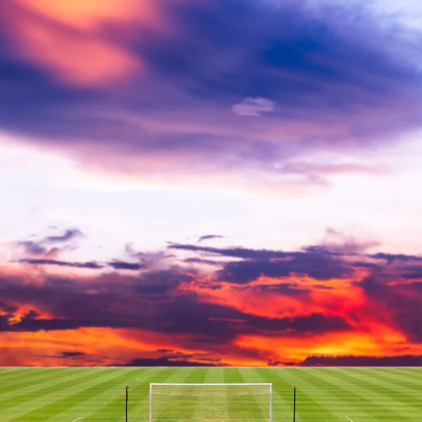 Soccer field with beautiful sunset background — Stock Photo, Image