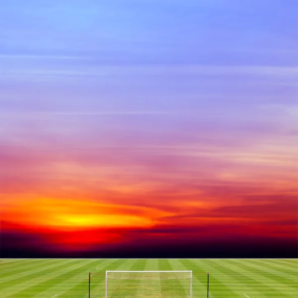 Soccer field with beautiful sunset background — Stock Photo, Image