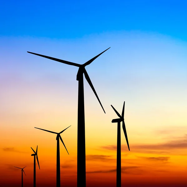 Wind turbine silhouette on colorful sunset — Stock Photo, Image