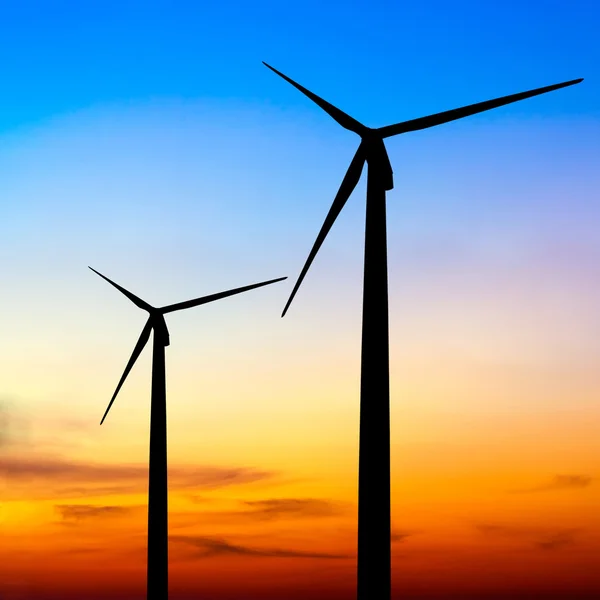 Wind turbine silhouette on colorful sunset — Stock Photo, Image