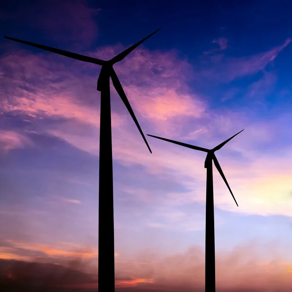 Wind turbine silhouette on colorful sunset — Stock Photo, Image