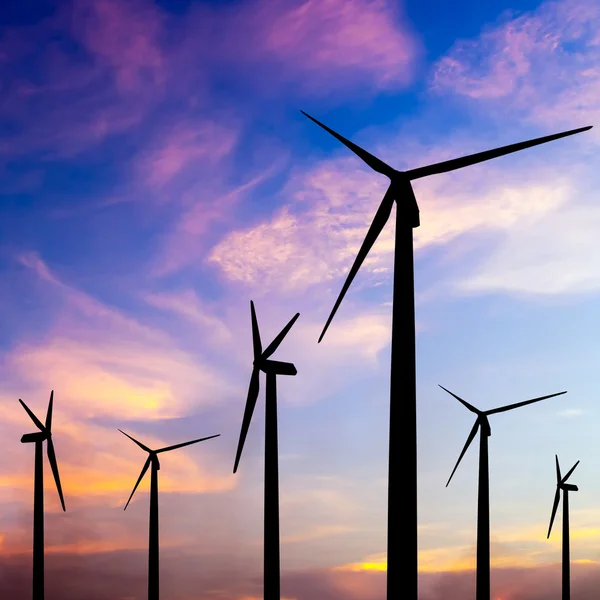 Wind turbine silhouette on colorful sunset — Stock Photo, Image