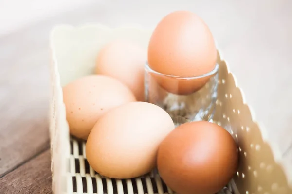 Chicken eggs in a basket — Stock Photo, Image