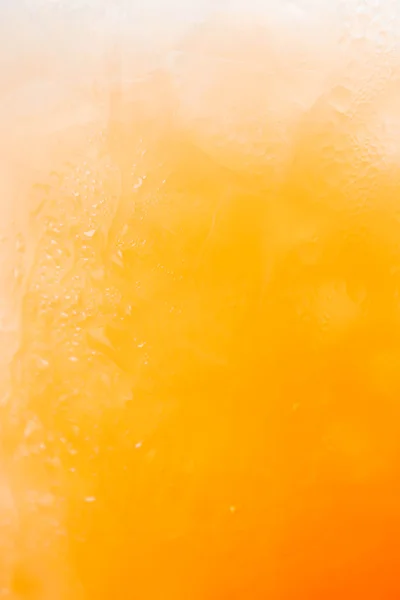 Natural gradient of iced orange juice and drops — Stock Photo, Image