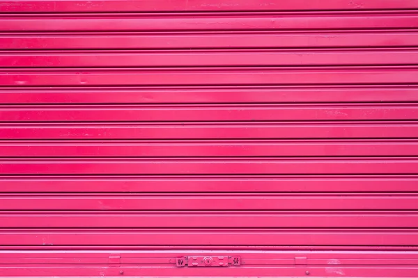 Red roller metal door surface of apartment — Stock Photo, Image
