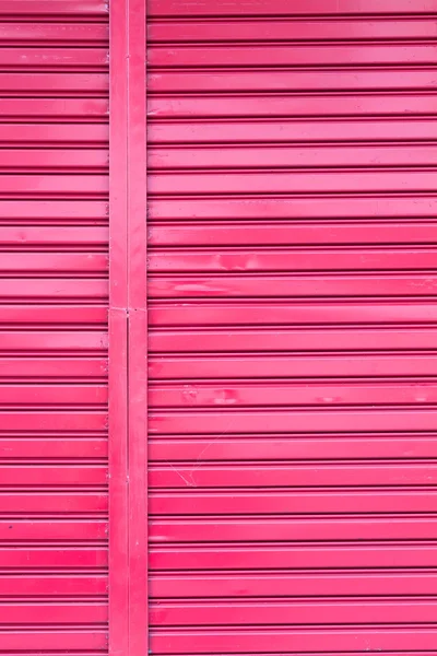Red roller metal entry door of apartment — Stock Photo, Image