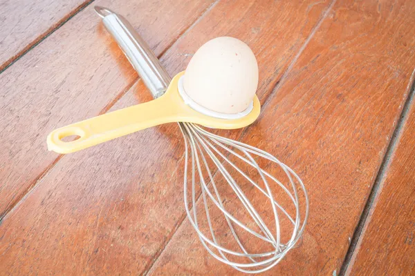 Bakery preparing with egg, yolk separator and hand mixer — Stock Photo, Image