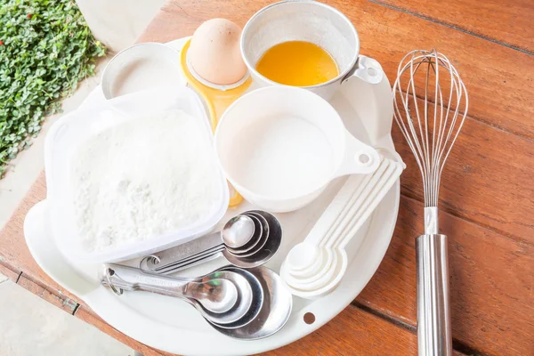 Set of baking ingredients with measure spoon — Stock Photo, Image