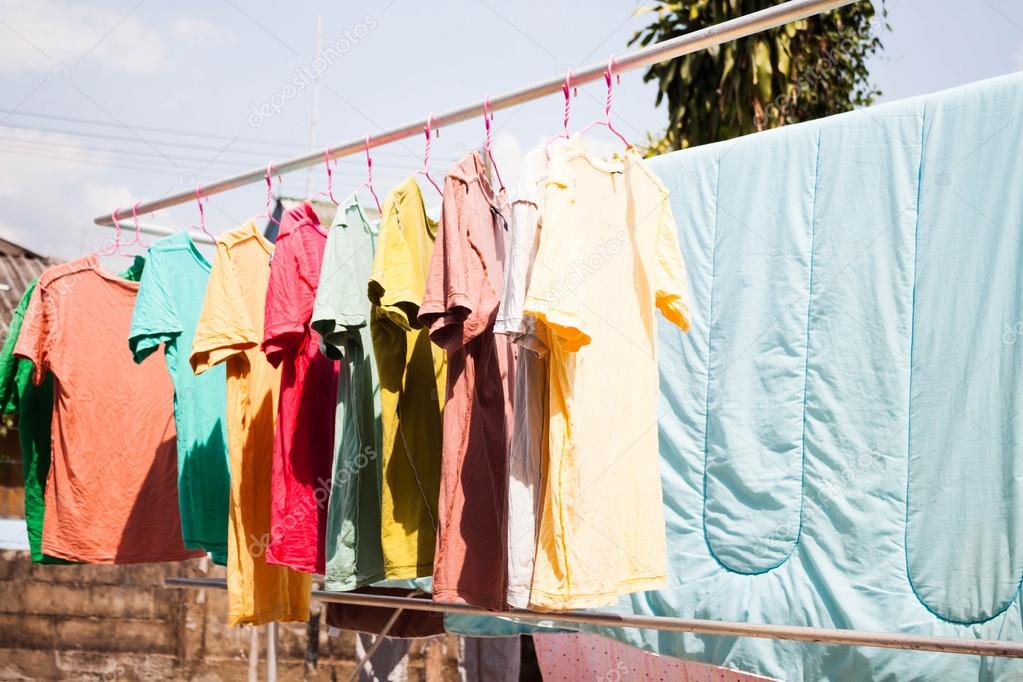 Hanging clothes online under the sun